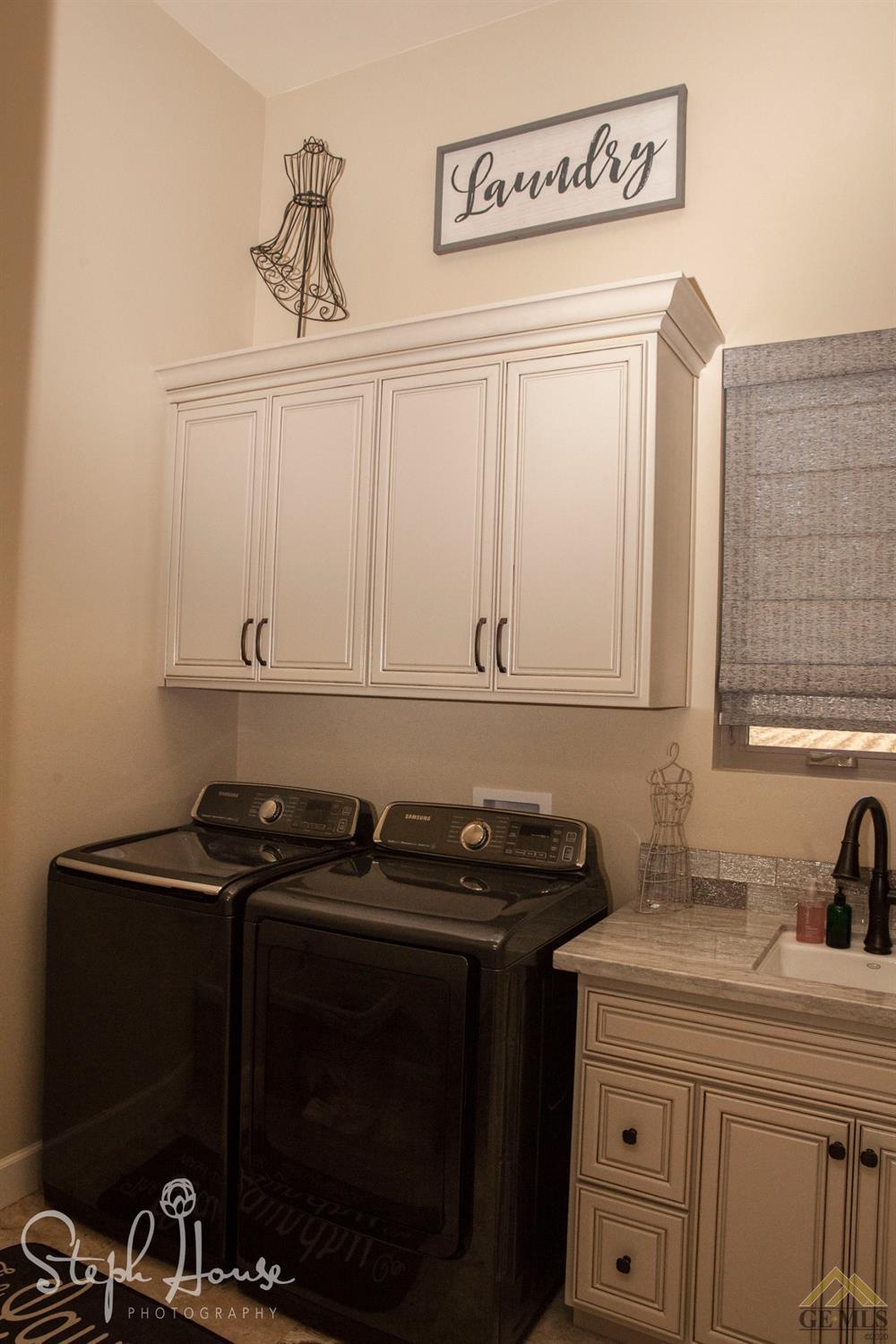 Undisclosed Address Arroyo Grande, CA 93420 - Photo 27 of 39 a close up of a sink and a cabinet with an umbrella