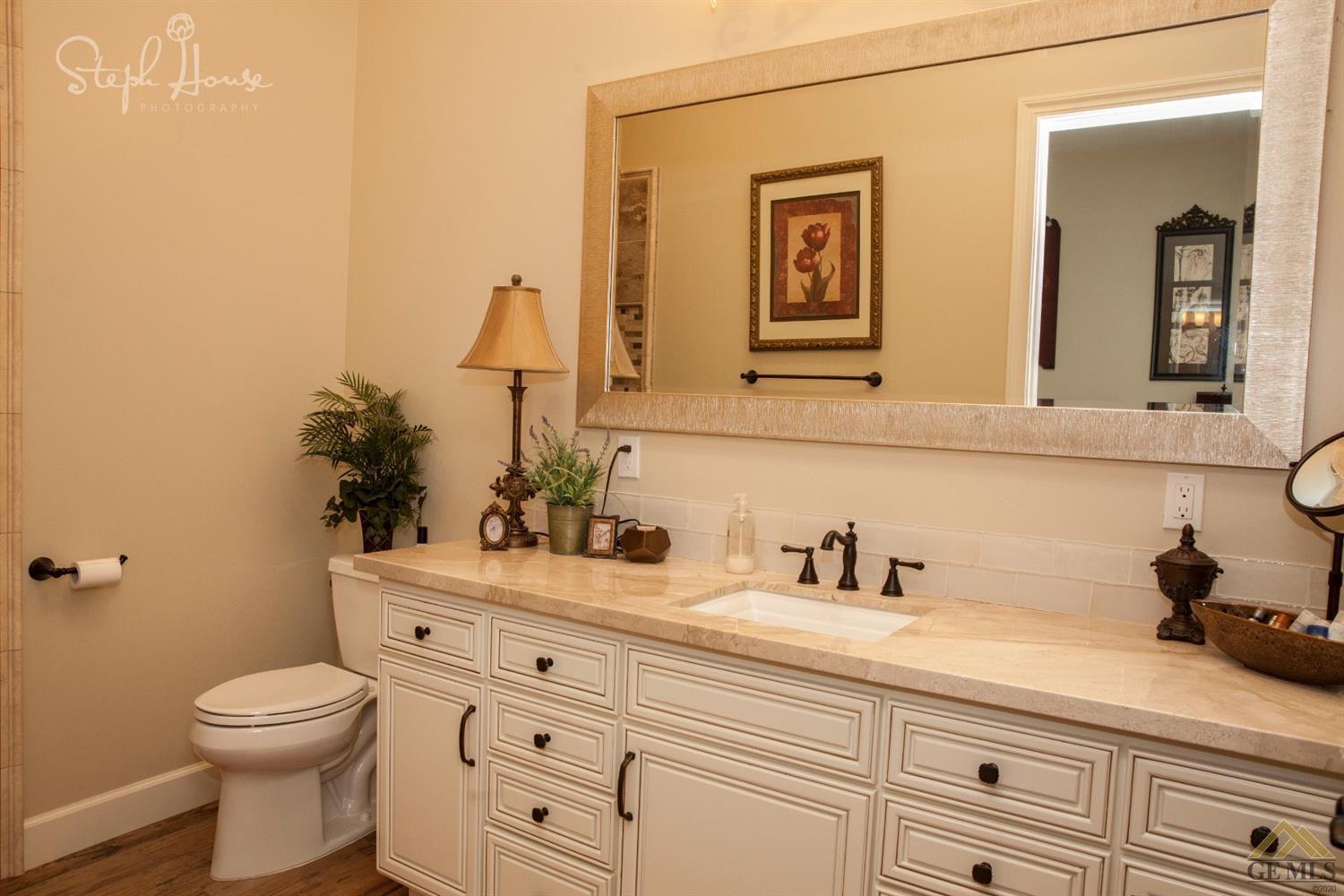 Undisclosed Address Arroyo Grande, CA 93420 - Photo 37 of 39 a bathroom with a toilet sink and mirror