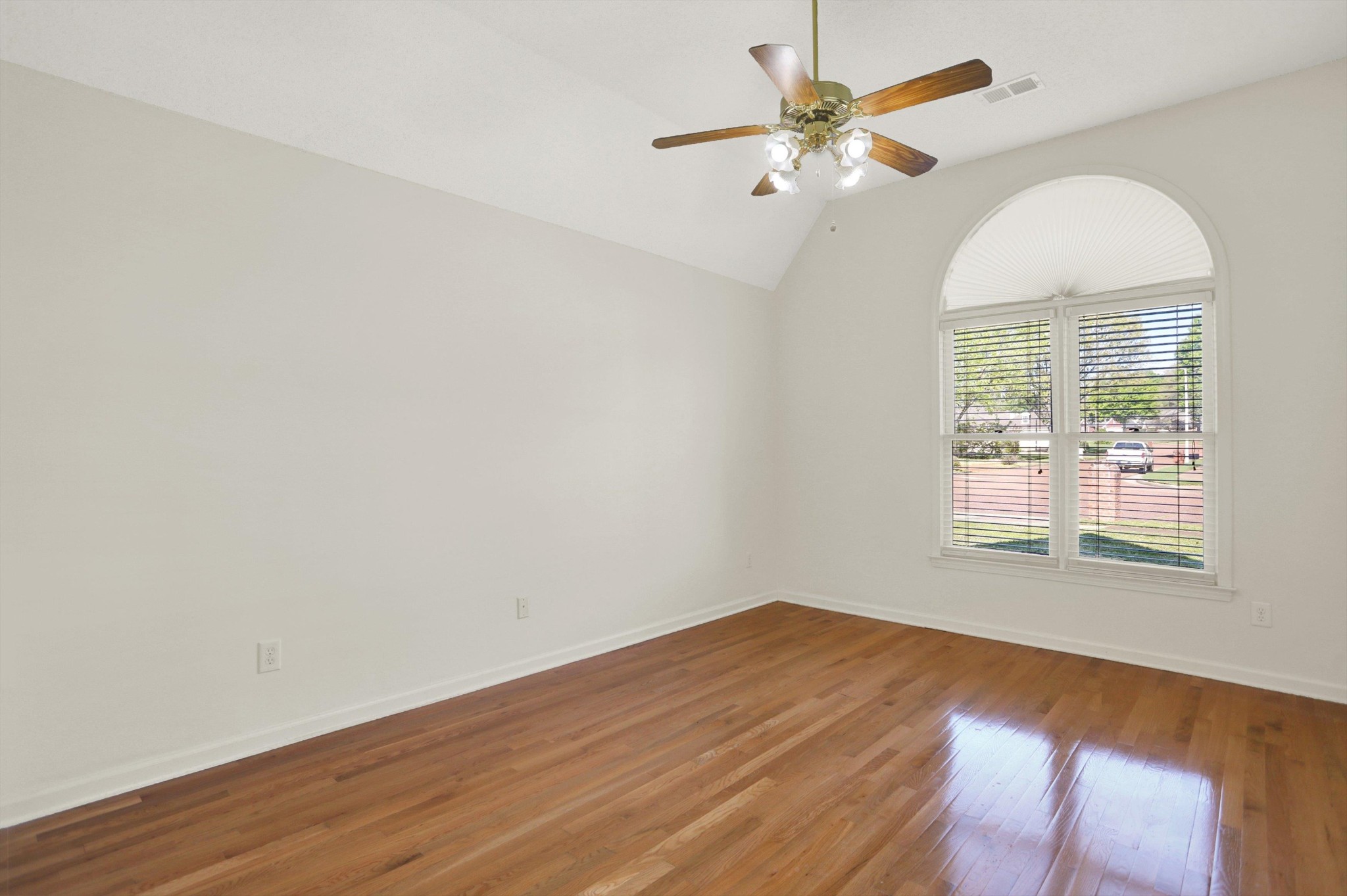 1130 Sugar Lane Collierville, TN 38017 - Photo 21 of 29 an empty room with wooden floor fan and windows