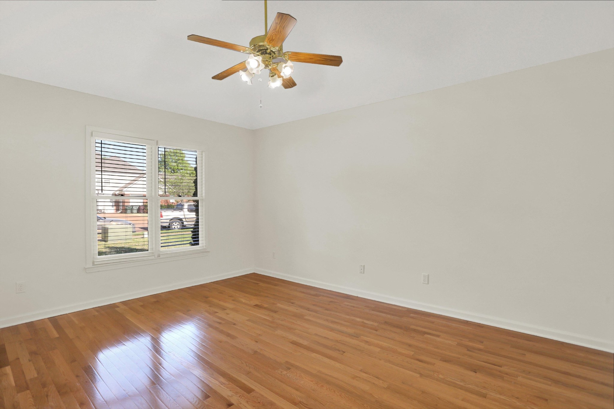 1130 Sugar Lane Collierville, TN 38017 - Photo 24 of 29 an empty room with wooden floor and windows