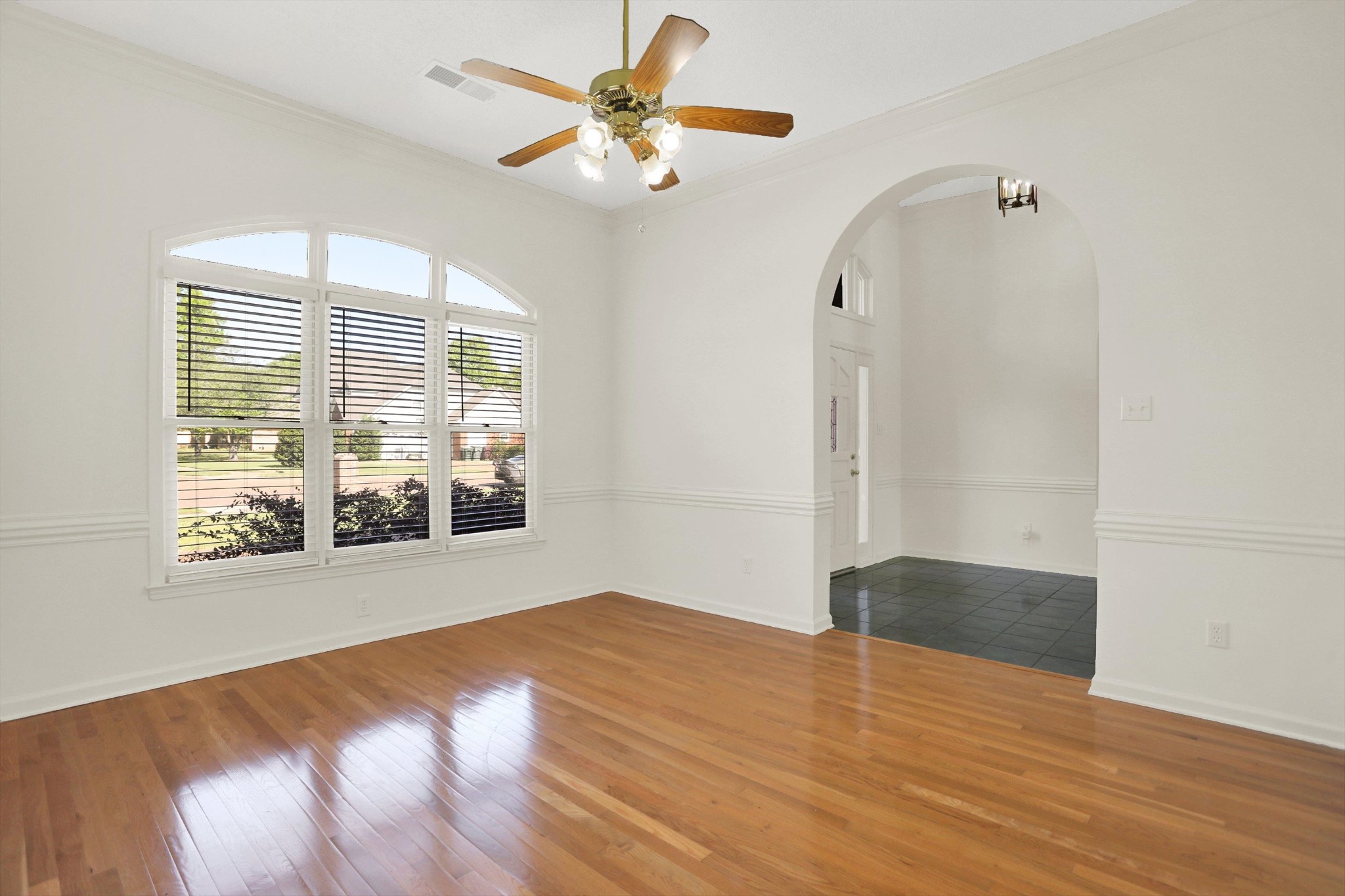 1130 Sugar Lane Collierville, TN 38017 - Photo 4 of 29 wooden floor in an empty room with a window