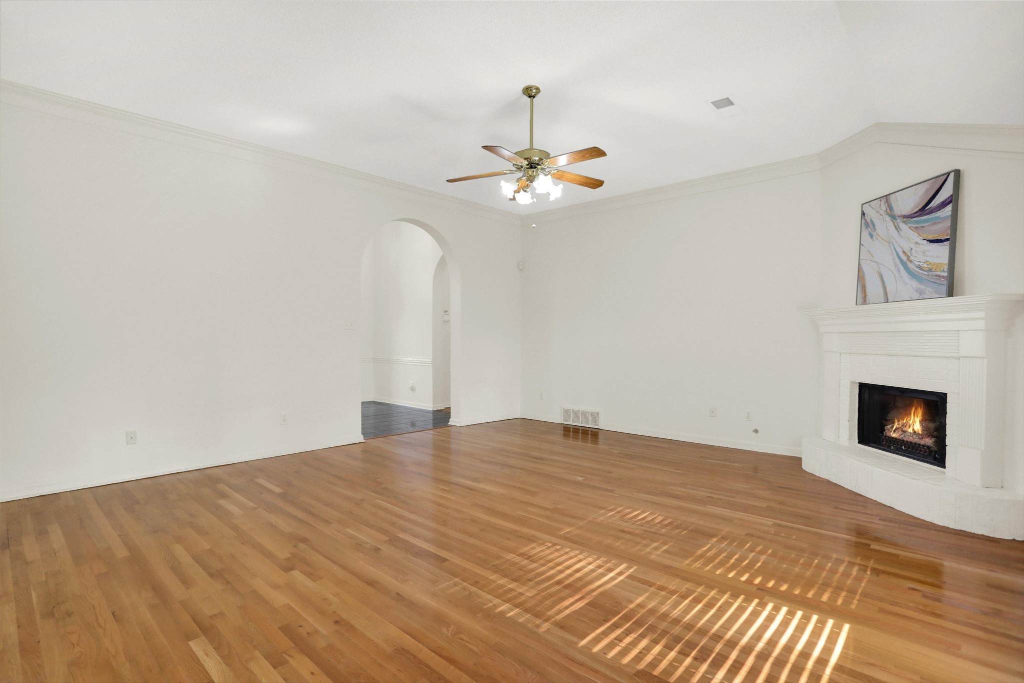 1130 Sugar Lane Collierville, TN 38017 - Photo 7 of 29 a view of an empty room with chandelier fan and fire place