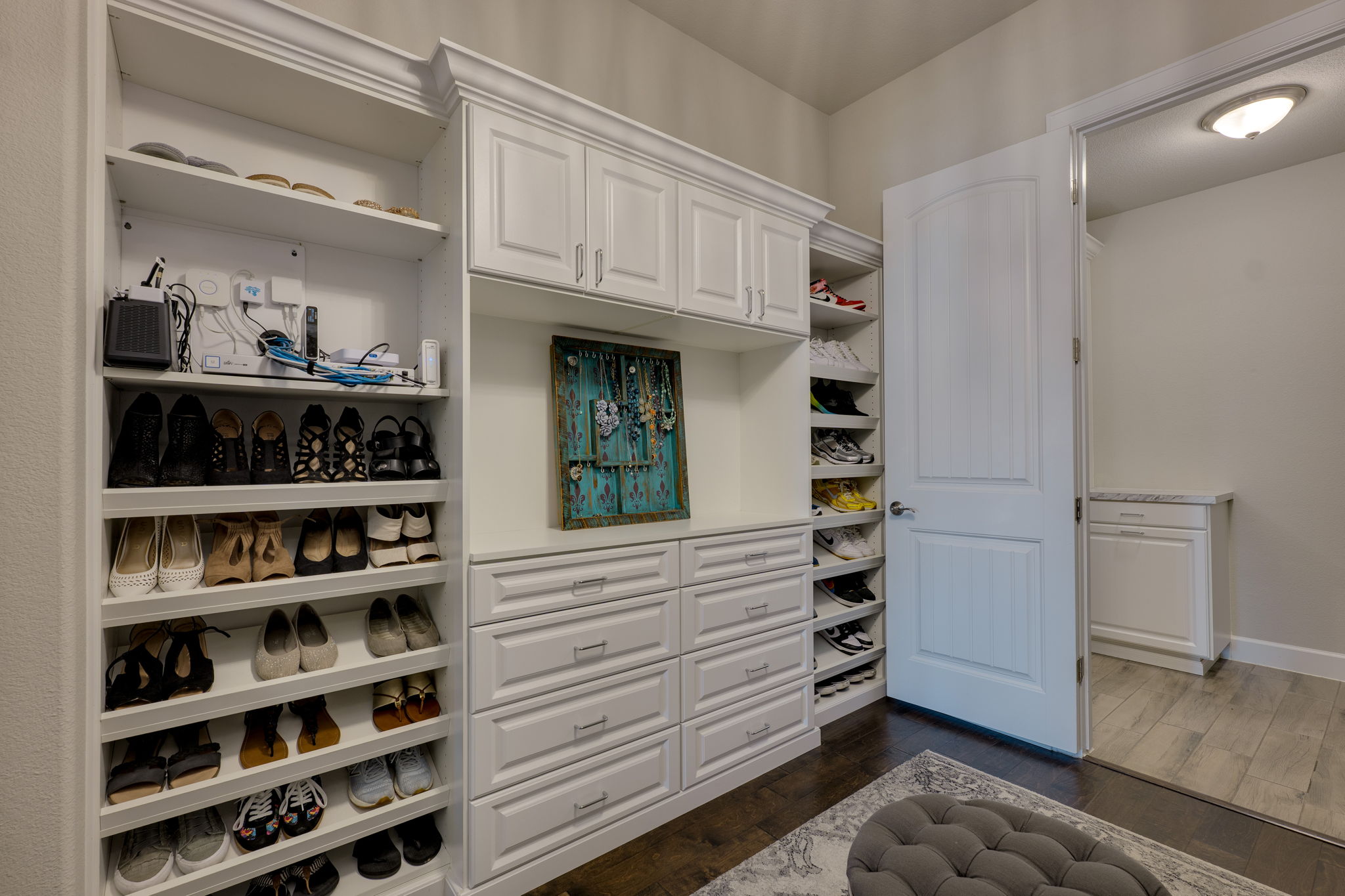 3300 Venezia View Leander, TX 78641 - Photo 14 of 33 Primary closet with custom built ins and a door leading directly to the laundry room