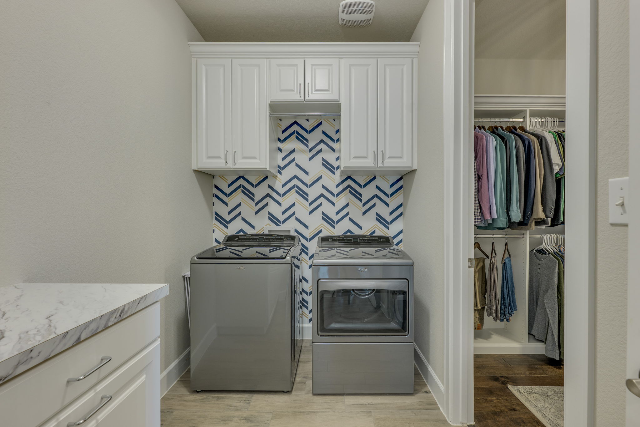 3300 Venezia View Leander, TX 78641 - Photo 15 of 33 Custom cabinets, laundry hamper and folding counter