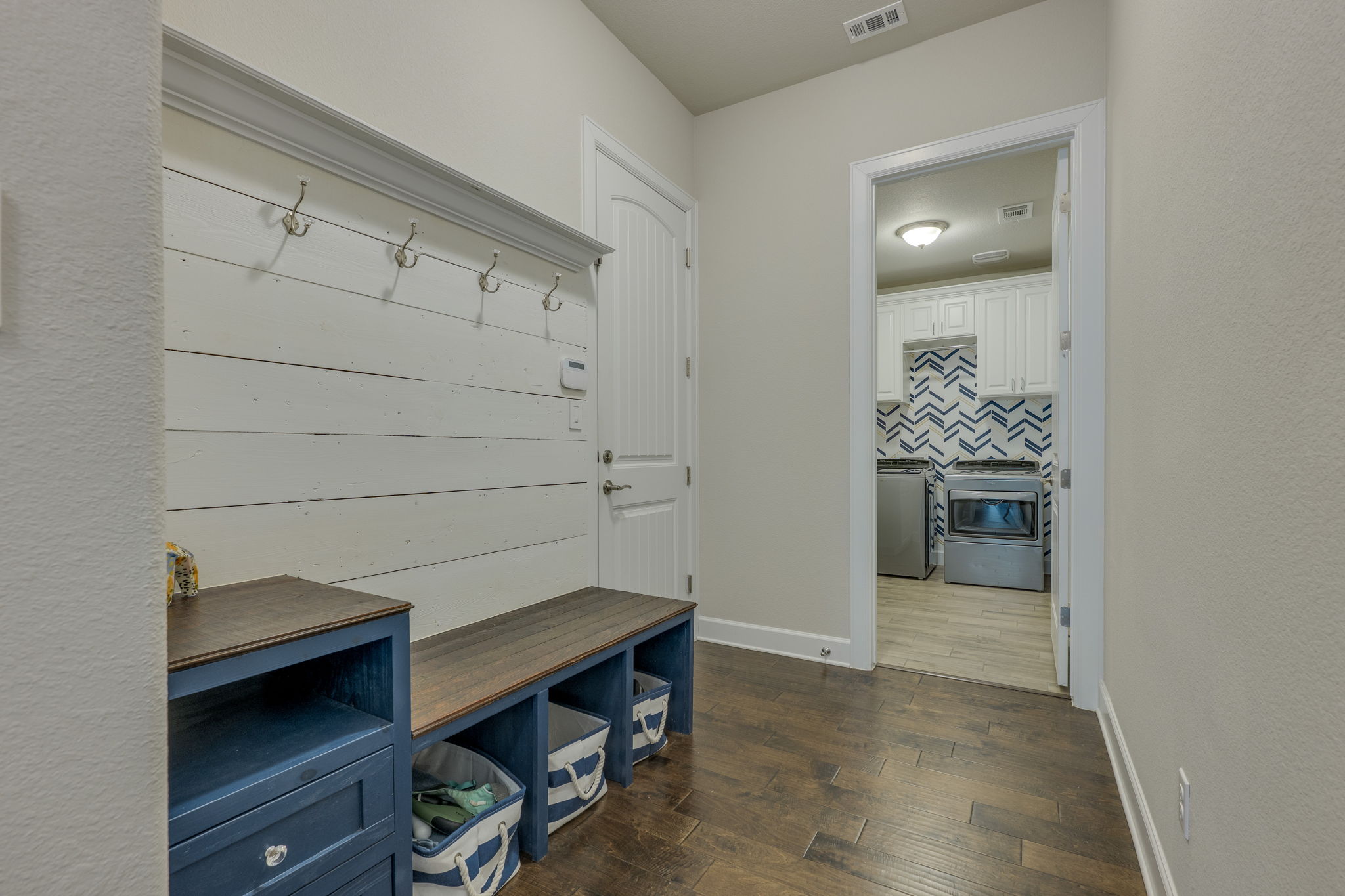 3300 Venezia View Leander, TX 78641 - Photo 16 of 33 Mud bench and storage conveniently located by the door to the garage and the laundry room