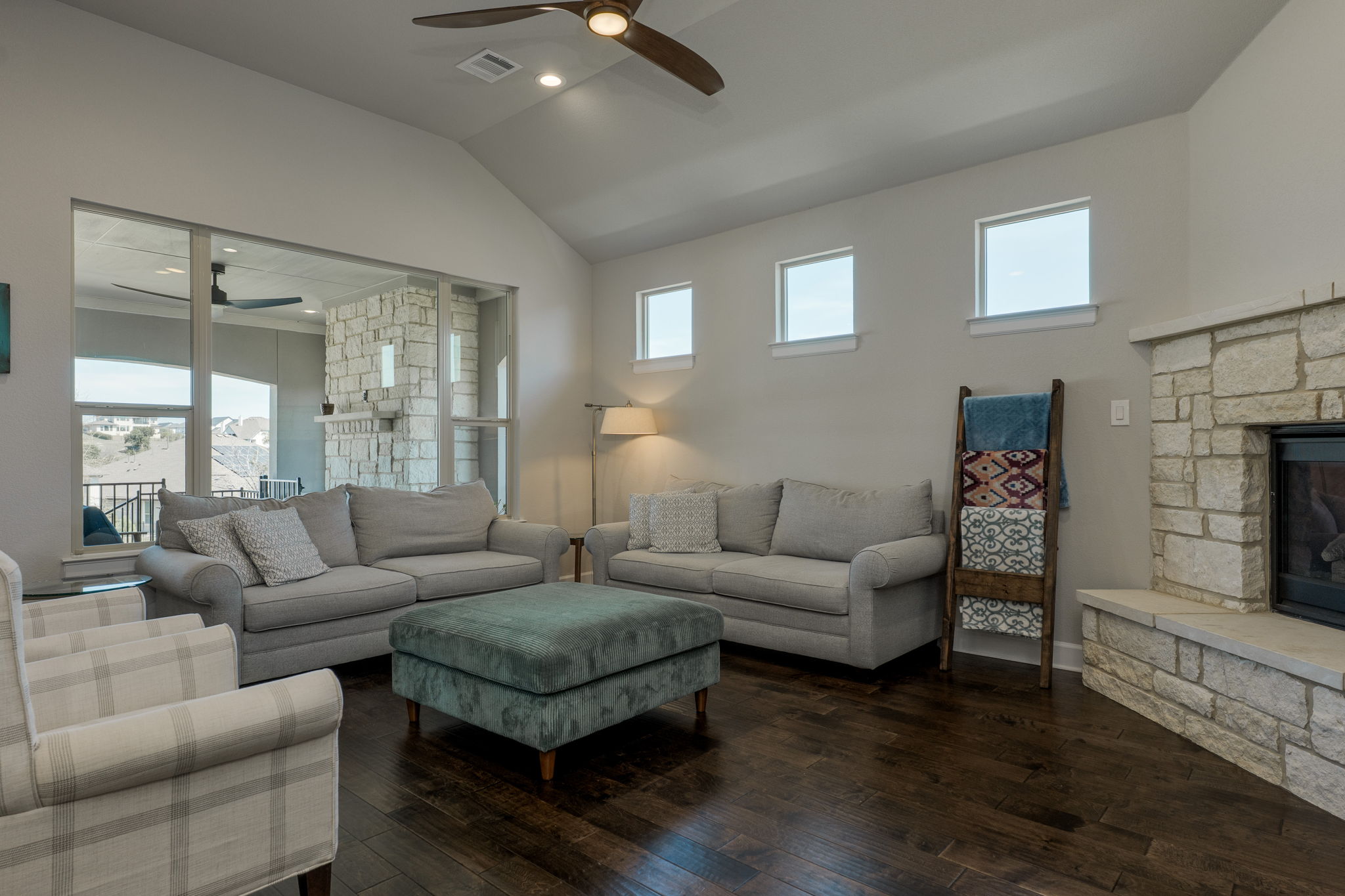 3300 Venezia View Leander, TX 78641 - Photo 4 of 33 Family room has vaulted ceiling and a fireplace with a hearth for sitting