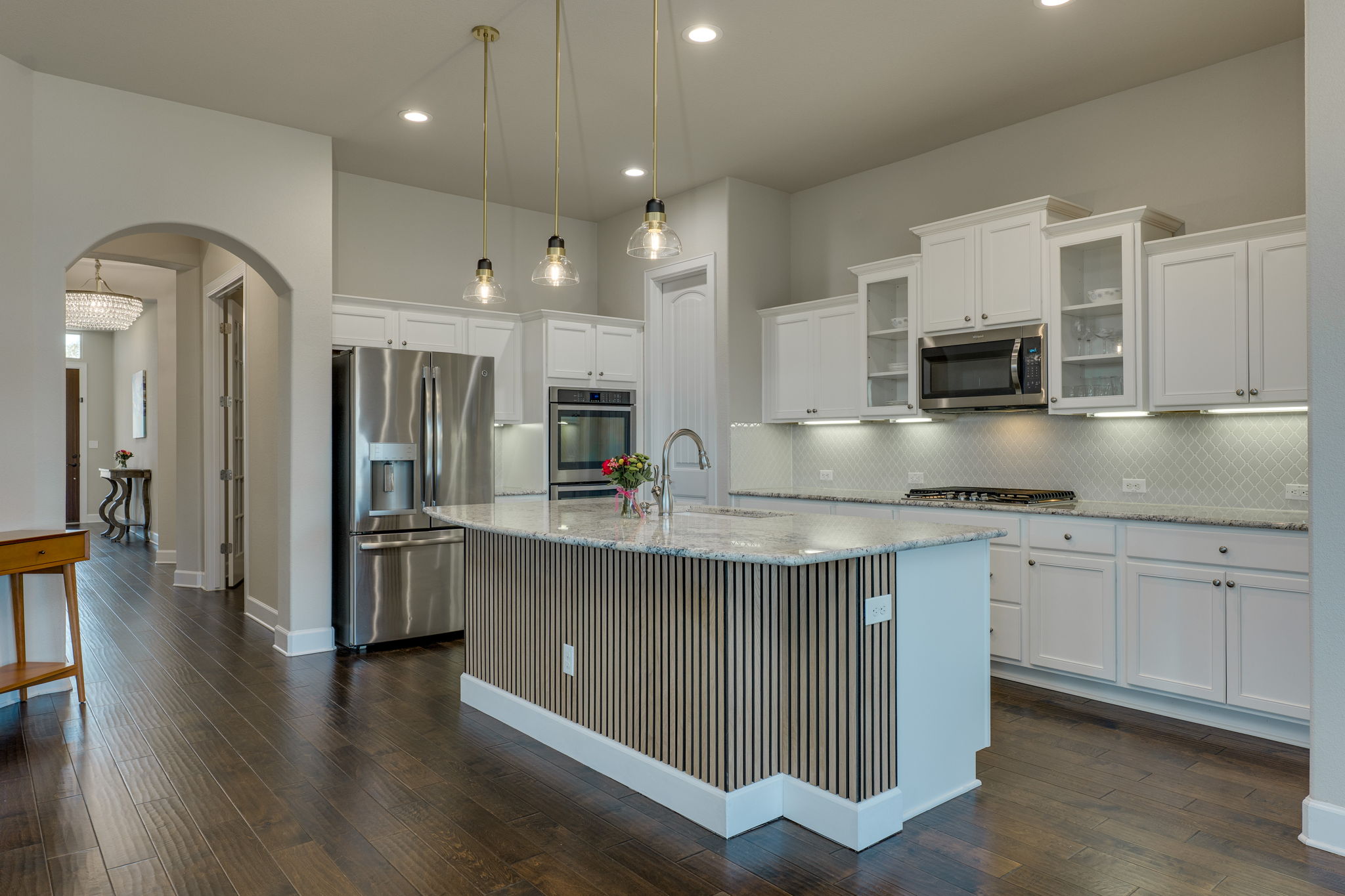 3300 Venezia View Leander, TX 78641 - Photo 7 of 33 Kitchen island has a custom wood surround and plenty of room for barstools