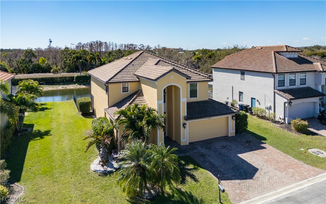 12906 Pastures Way Fort Myers, FL 33913 - Photo 1 of 44 a front view of a house with garden