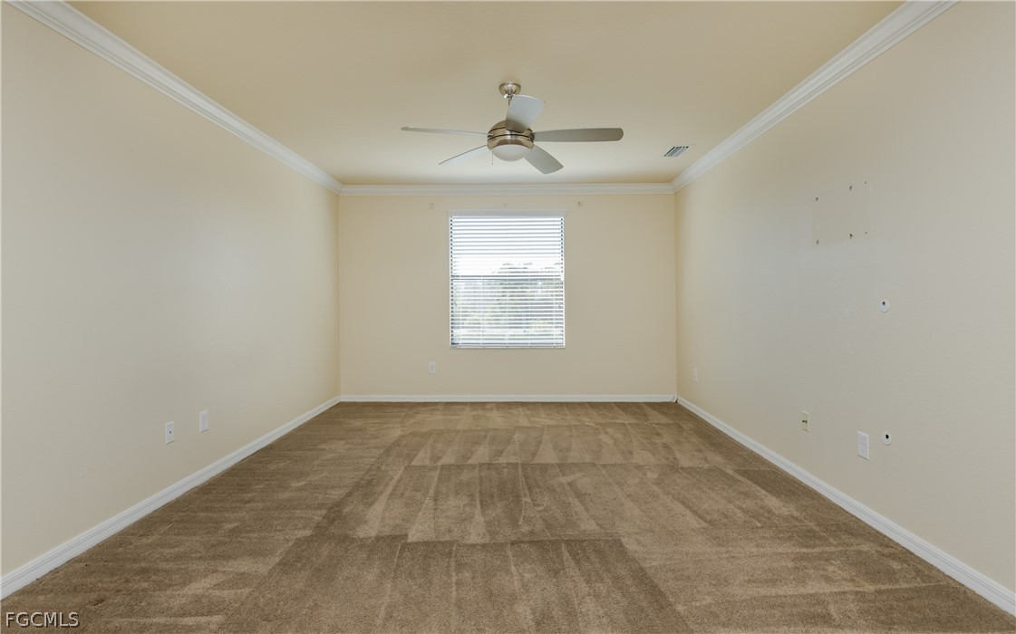 12906 Pastures Way Fort Myers, FL 33913 - Photo 15 of 44 an empty room with a window and a ceiling fan