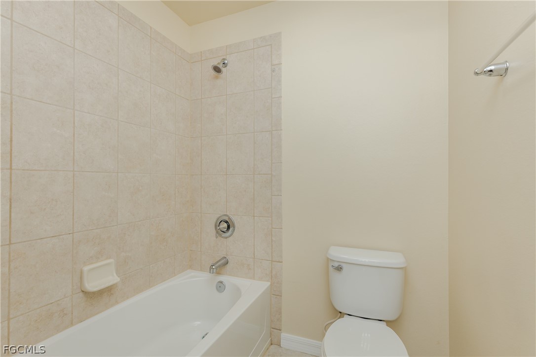 12906 Pastures Way Fort Myers, FL 33913 - Photo 25 of 44 a white toilet sitting next to a bath tub