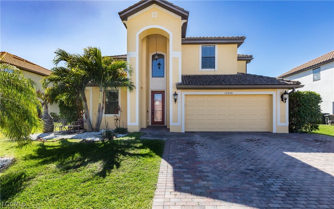 12906 Pastures Way Fort Myers, FL 33913 - Photo 3 of 44 a front view of a house with a yard and garage