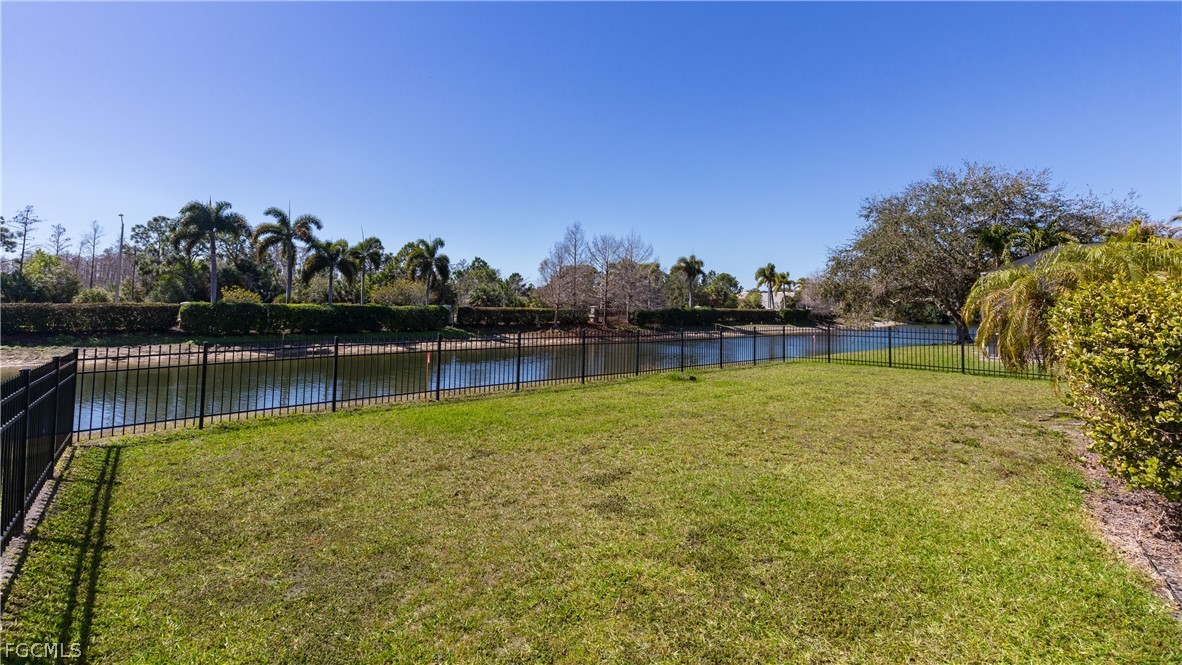 12906 Pastures Way Fort Myers, FL 33913 - Photo 32 of 44 a view of a lake with houses in the back