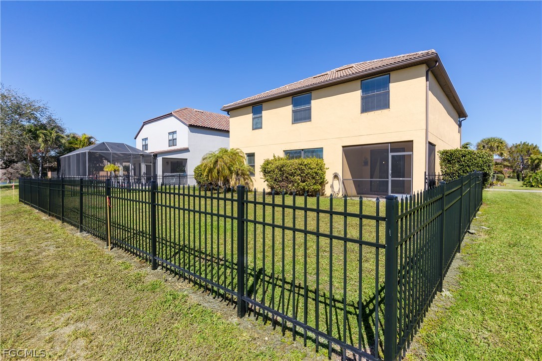 12906 Pastures Way Fort Myers, FL 33913 - Photo 36 of 44 a view of a house with iron fence