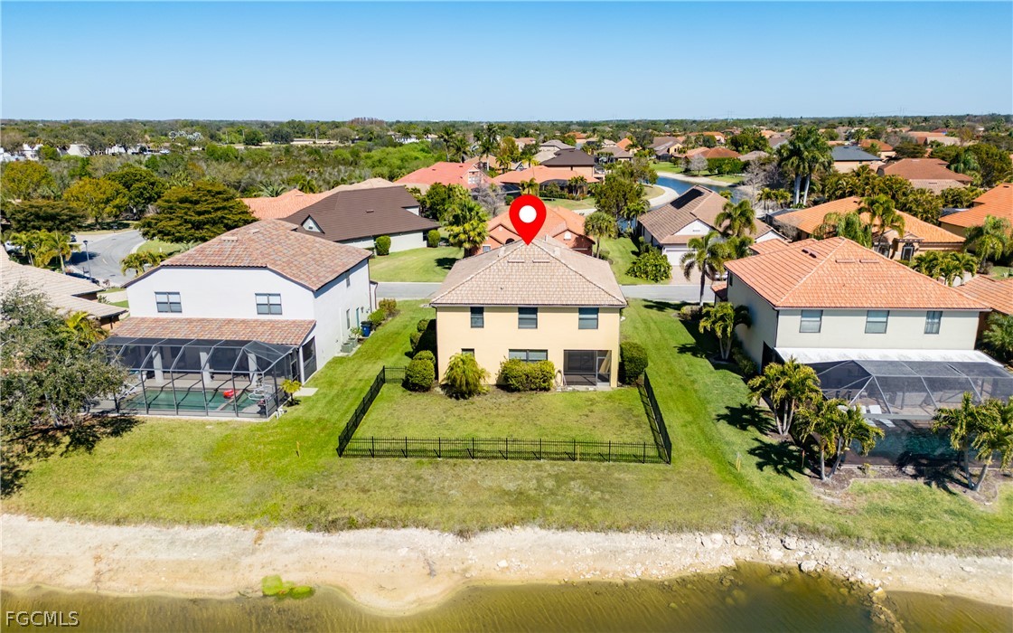 12906 Pastures Way Fort Myers, FL 33913 - Photo 37 of 44 an aerial view of a house with a garden and lake view