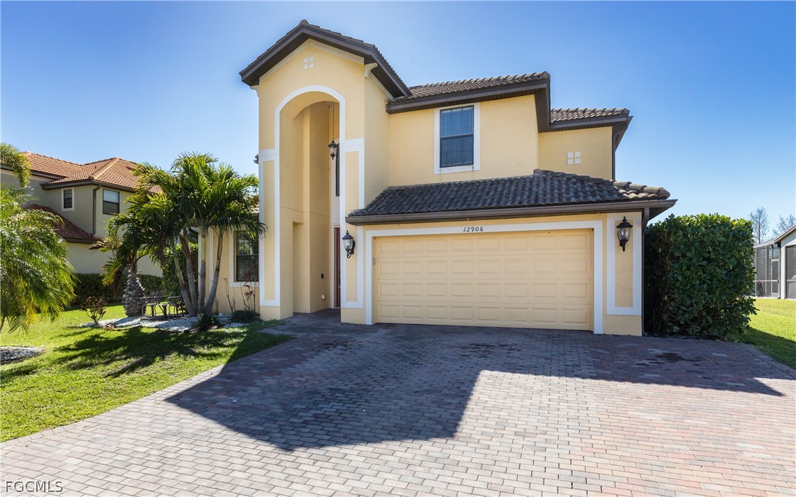 12906 Pastures Way Fort Myers, FL 33913 - Photo 4 of 44 a front view of a house with a yard and garage