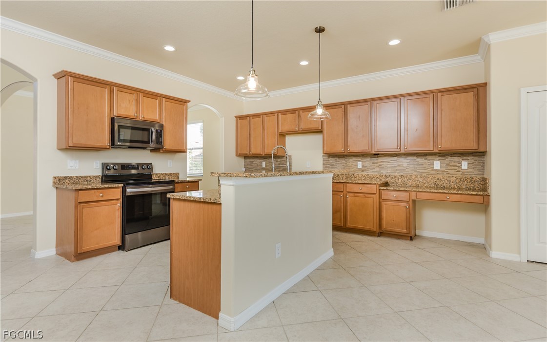 12906 Pastures Way Fort Myers, FL 33913 - Photo 8 of 44 a kitchen with a stove a sink and a refrigerator