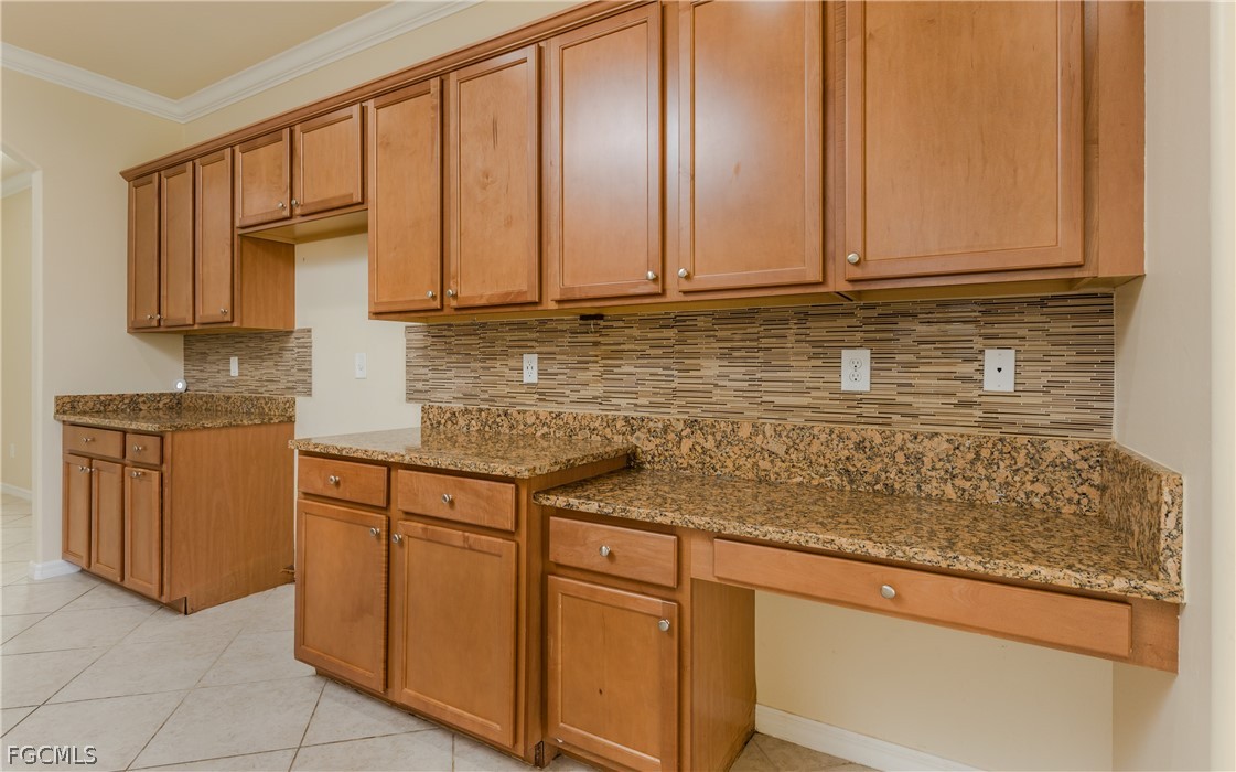 12906 Pastures Way Fort Myers, FL 33913 - Photo 9 of 44 a kitchen with stainless steel appliances granite countertop a sink and cabinets