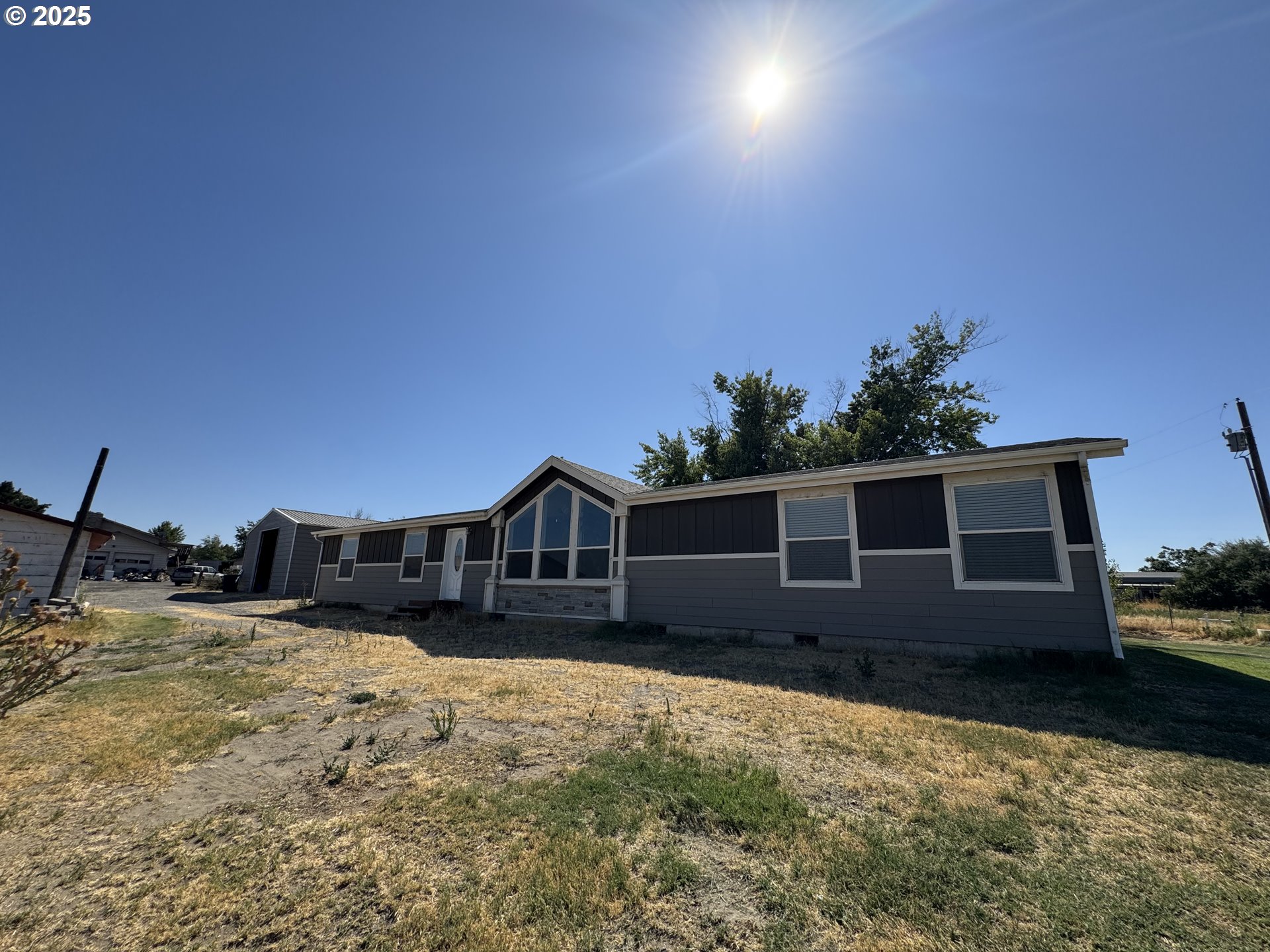 70753 Quail Lane Boardman, OR 97818 - Photo 1 of 26 a view of a house with a yard