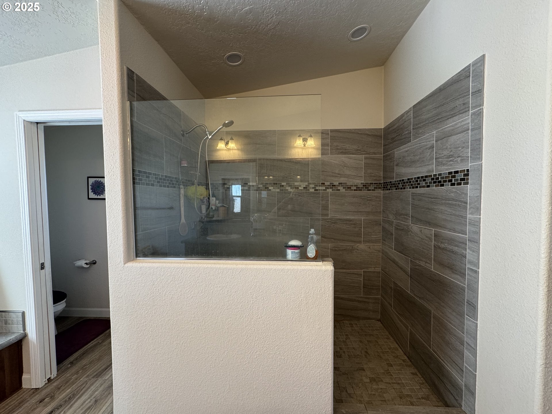 70753 Quail Lane Boardman, OR 97818 - Photo 13 of 26 a bathroom with a shower and a sink