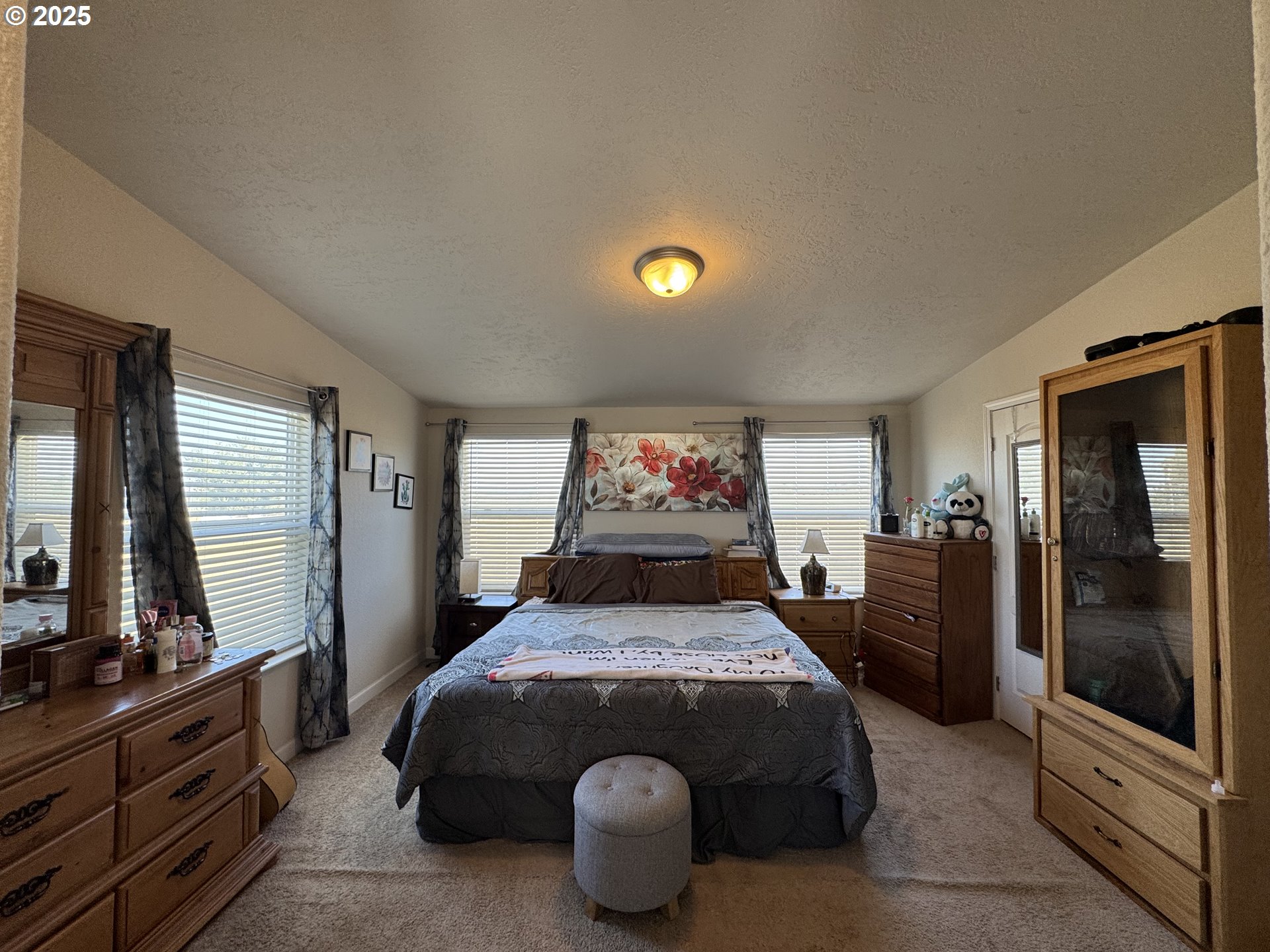 70753 Quail Lane Boardman, OR 97818 - Photo 14 of 26 a bed sitting in a bedroom and next to a window