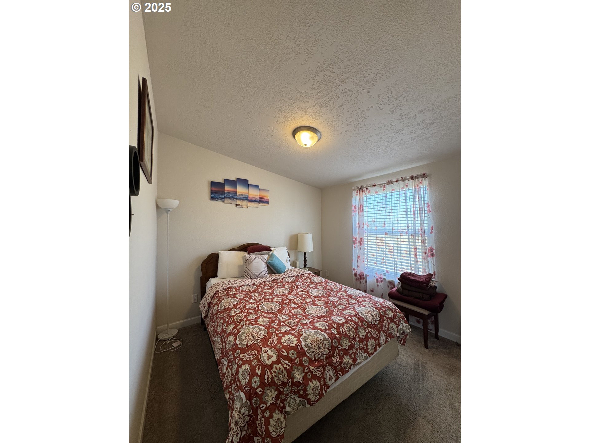 70753 Quail Lane Boardman, OR 97818 - Photo 20 of 26 a bedroom with a bed and a window