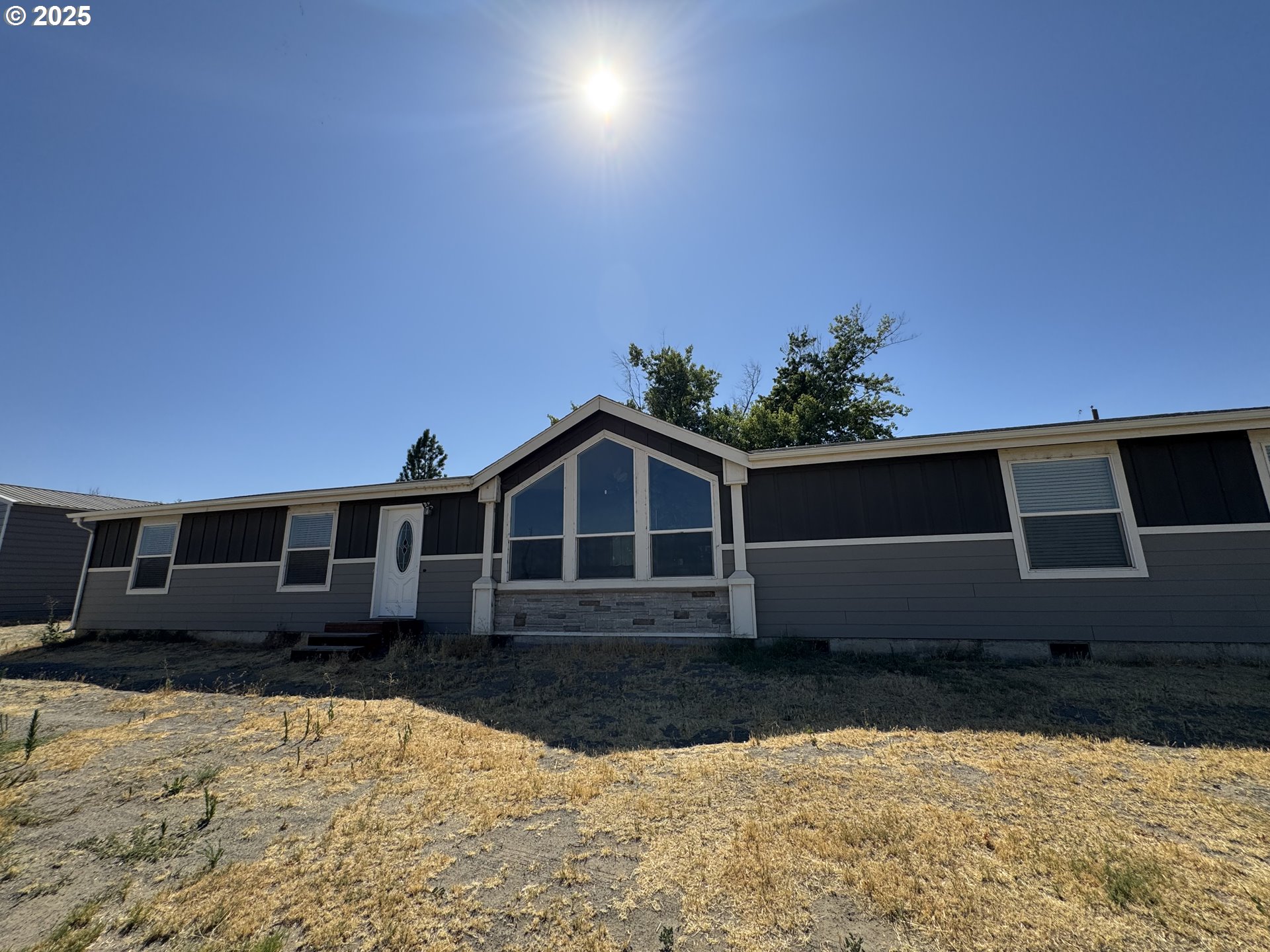 70753 Quail Lane Boardman, OR 97818 - Photo 2 of 26 a front view of a house with a yard