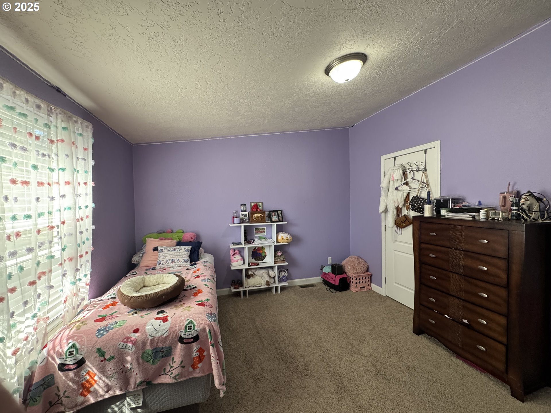 70753 Quail Lane Boardman, OR 97818 - Photo 21 of 26 a bedroom with a bed and a window