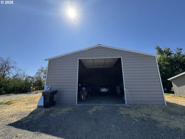 a backyard of a house with lots of green space