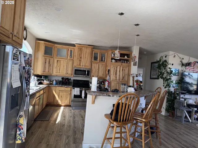 a view of living room kitchen and dining room