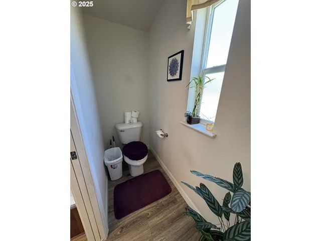 a view of workspace with wooden floor and chair