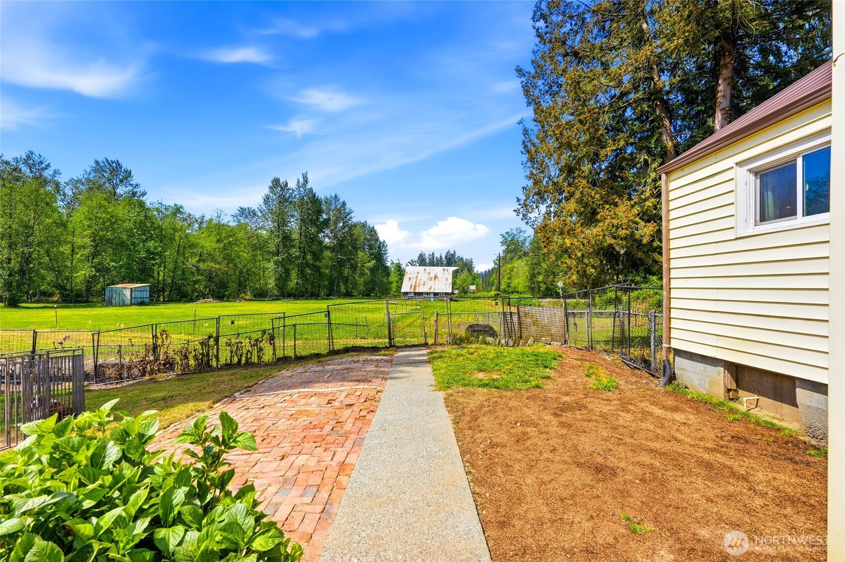21716 State Rte 530 Northeast Arlington, WA 98223 - Photo 24 of 38 a view of backyard with swimming pool and green space