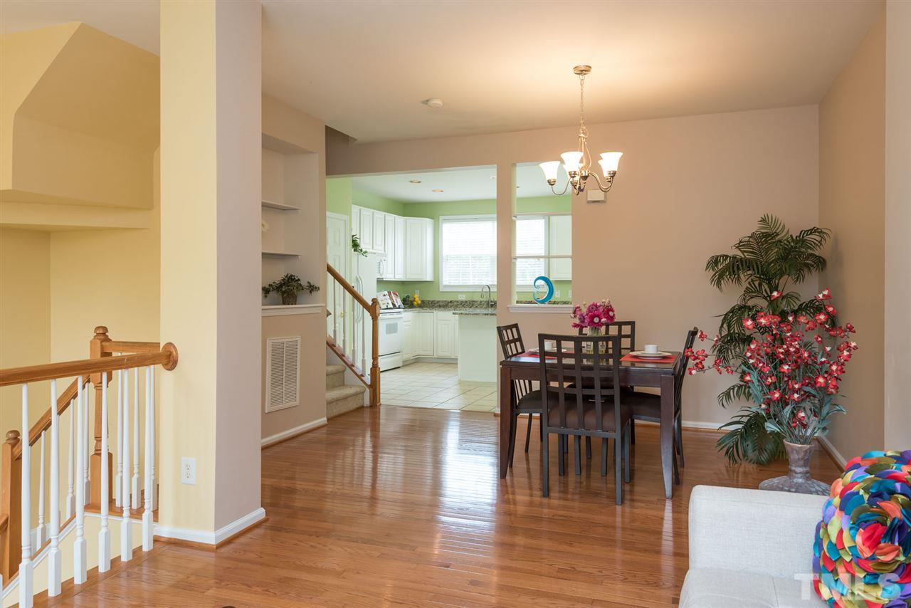 5222 Echo Ridge Road Raleigh, NC 27612 - Photo 11 of 25 a view of a dining room with furniture and wooden floor