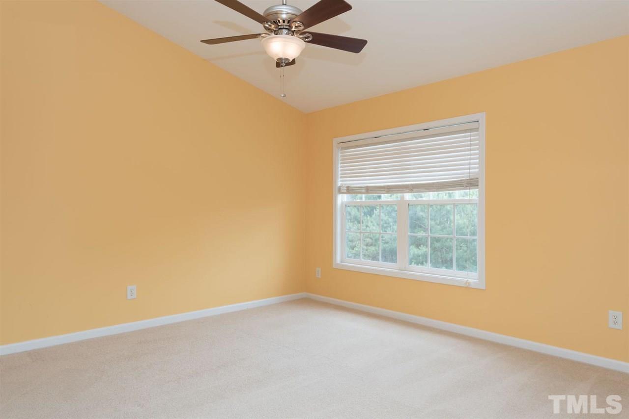 5222 Echo Ridge Road Raleigh, NC 27612 - Photo 17 of 25 an empty room with a window and a fan