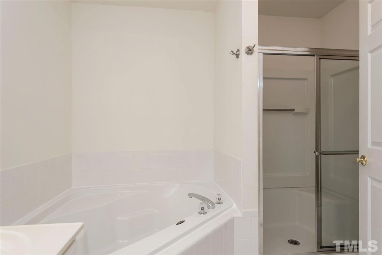 5222 Echo Ridge Road Raleigh, NC 27612 - Photo 21 of 25 a bathroom with a bathtub