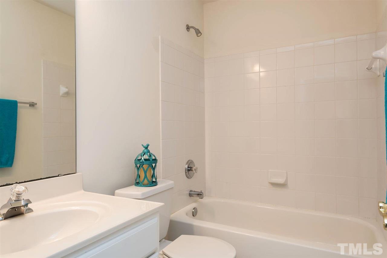 5222 Echo Ridge Road Raleigh, NC 27612 - Photo 22 of 25 a bathroom with a sink and a bathtub