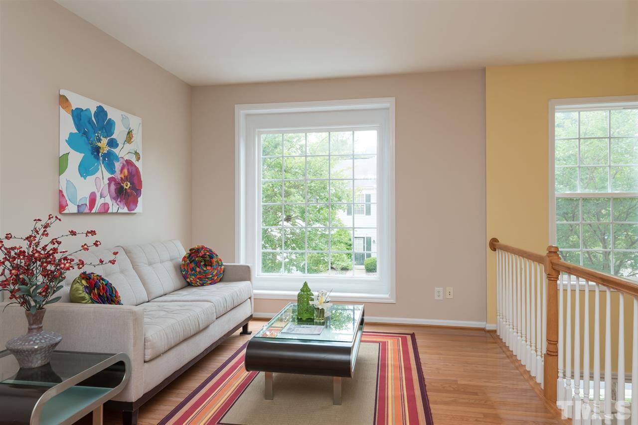5222 Echo Ridge Road Raleigh, NC 27612 - Photo 10 of 25 a living room with furniture and a large window