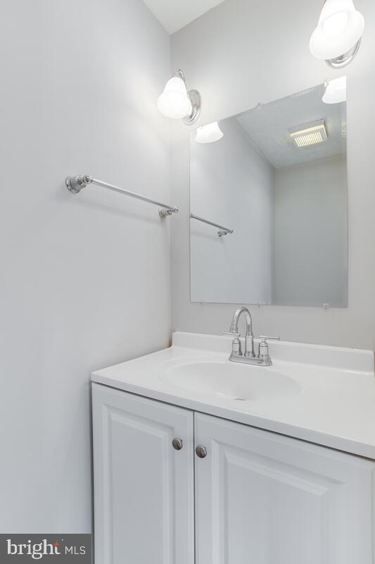 1308 Apple Ridge Court Edgewood, MD 21040 - Photo 10 of 38 a bathroom with a sink vanity and a mirror