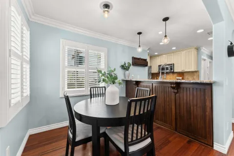 a dining room with furniture and window