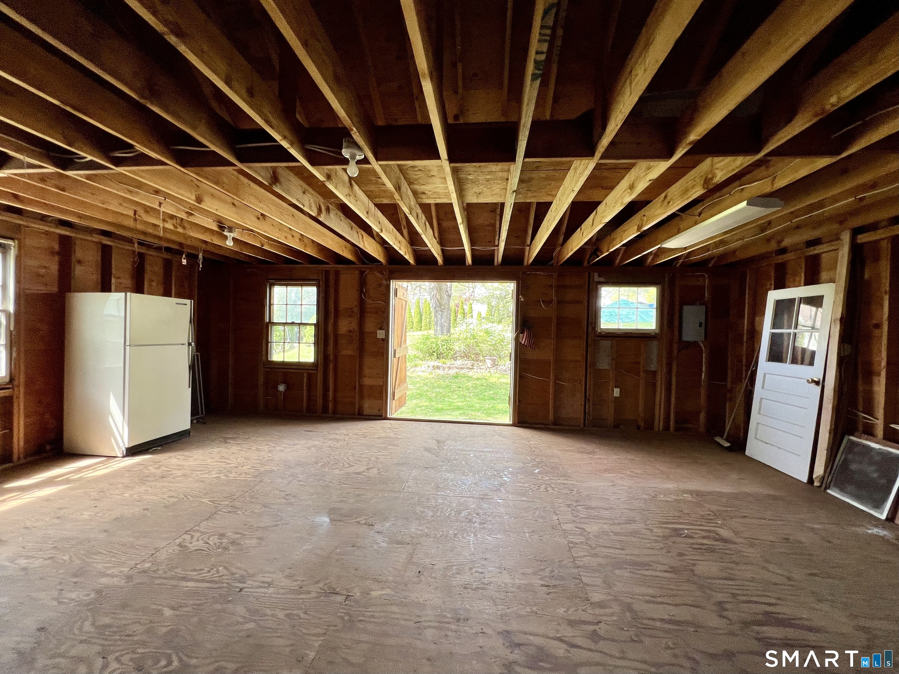 213 Hart Street Berlin, CT 06037 - Photo 11 of 40 a view of an empty room with a fireplace and a window