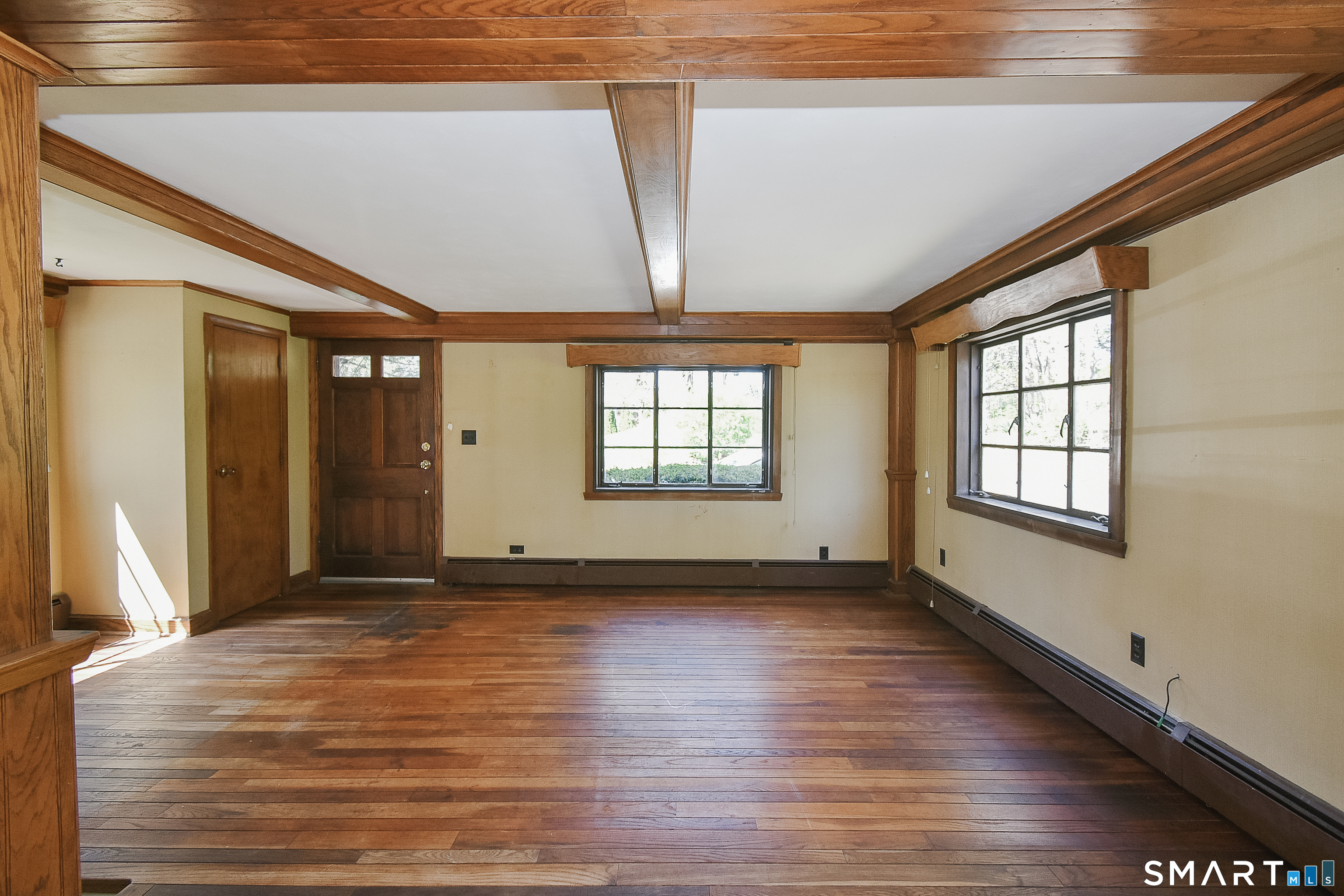 213 Hart Street Berlin, CT 06037 - Photo 14 of 40 a view of an empty room with wooden floor and a window
