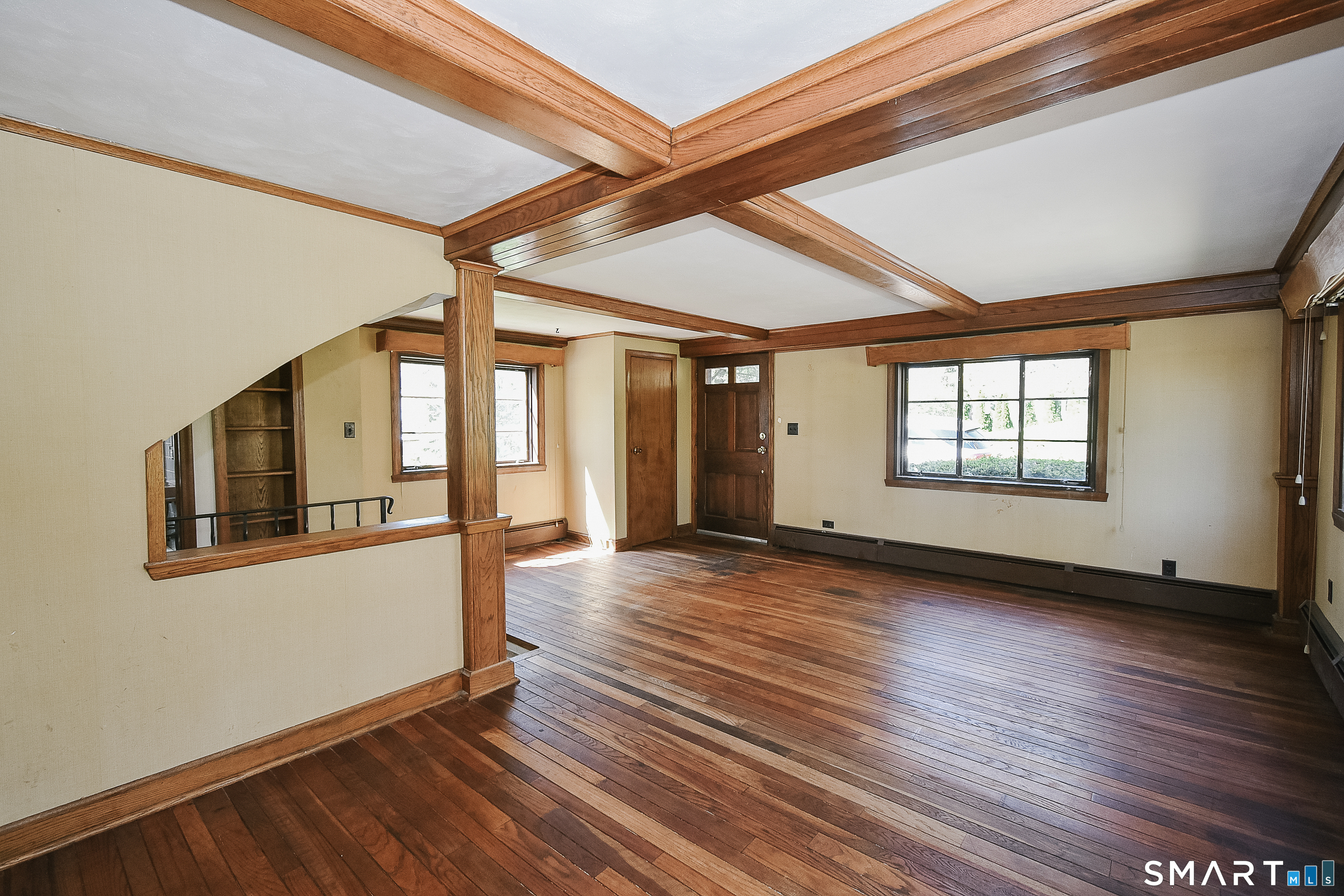 213 Hart Street Berlin, CT 06037 - Photo 15 of 40 a view of an empty room with wooden floor and a window