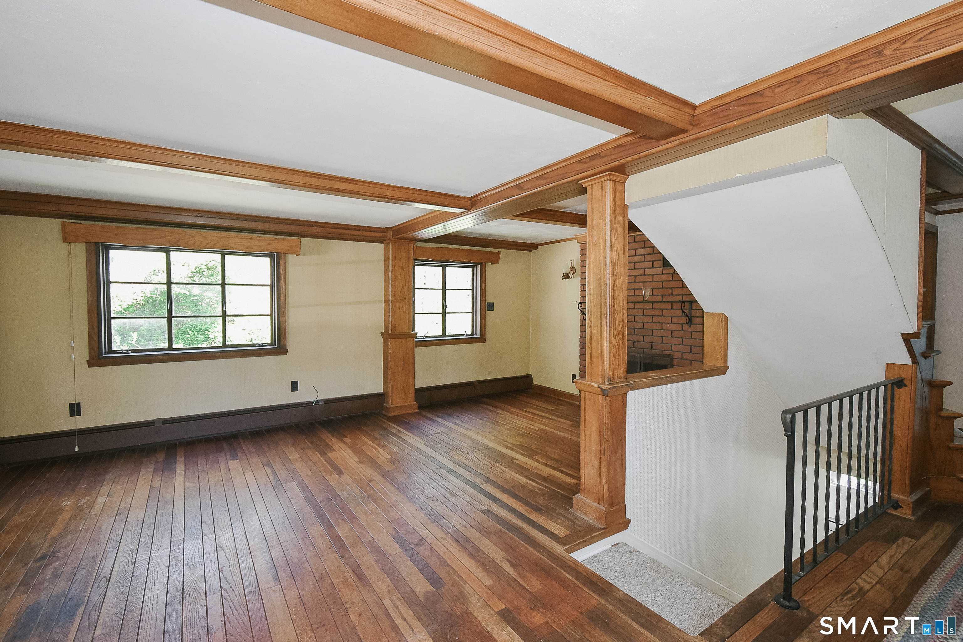 213 Hart Street Berlin, CT 06037 - Photo 18 of 40 a view of an empty room with wooden floor and a window