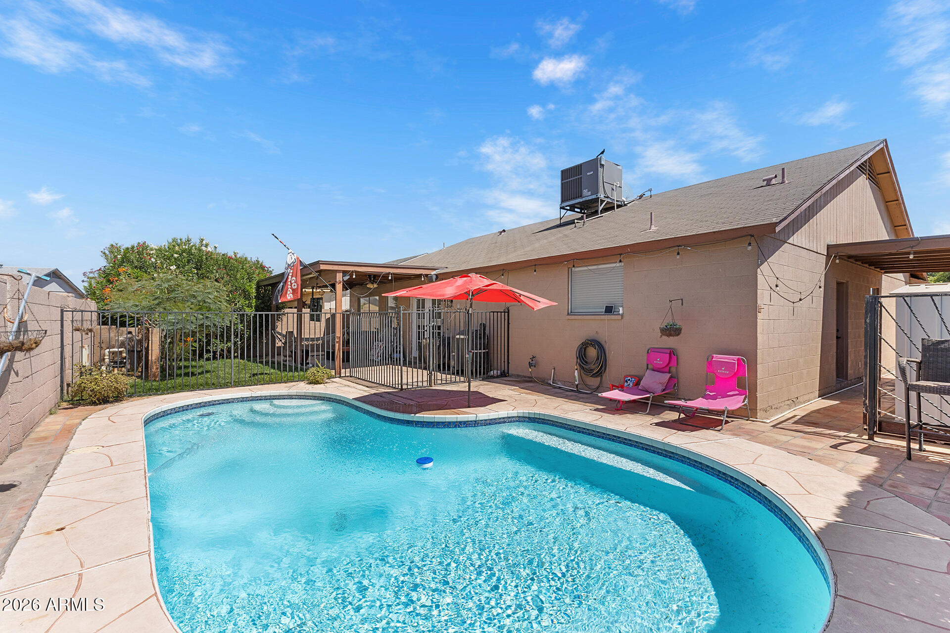 9002 West Coronado Road Phoenix, AZ 85037 - Photo 5 of 54 a view of a backyard with swimming pool