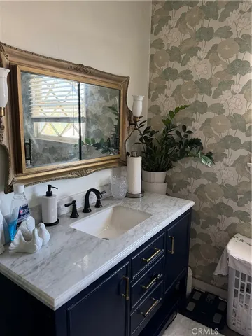 a kitchen with a sink and a large window