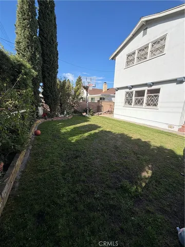 a view of a big house with a big yard