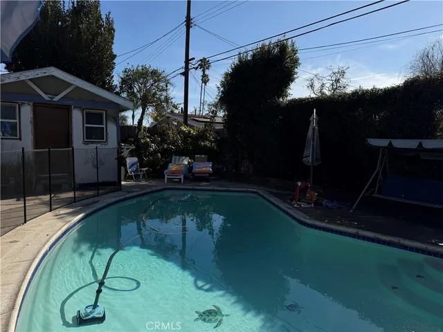 a swimming pool with barbeque oven