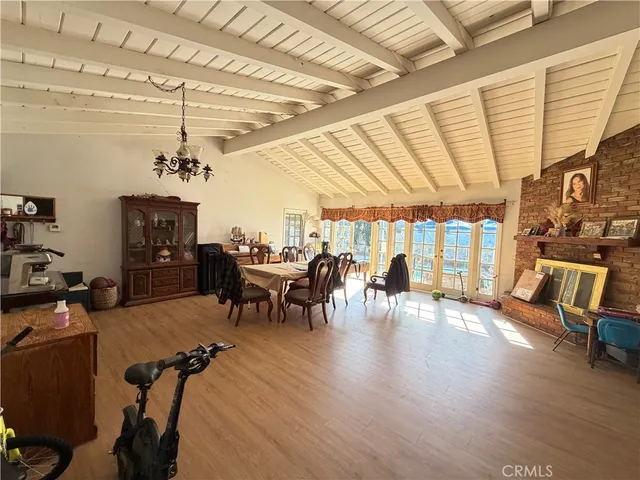 a view of a room with furniture window and wooden floor