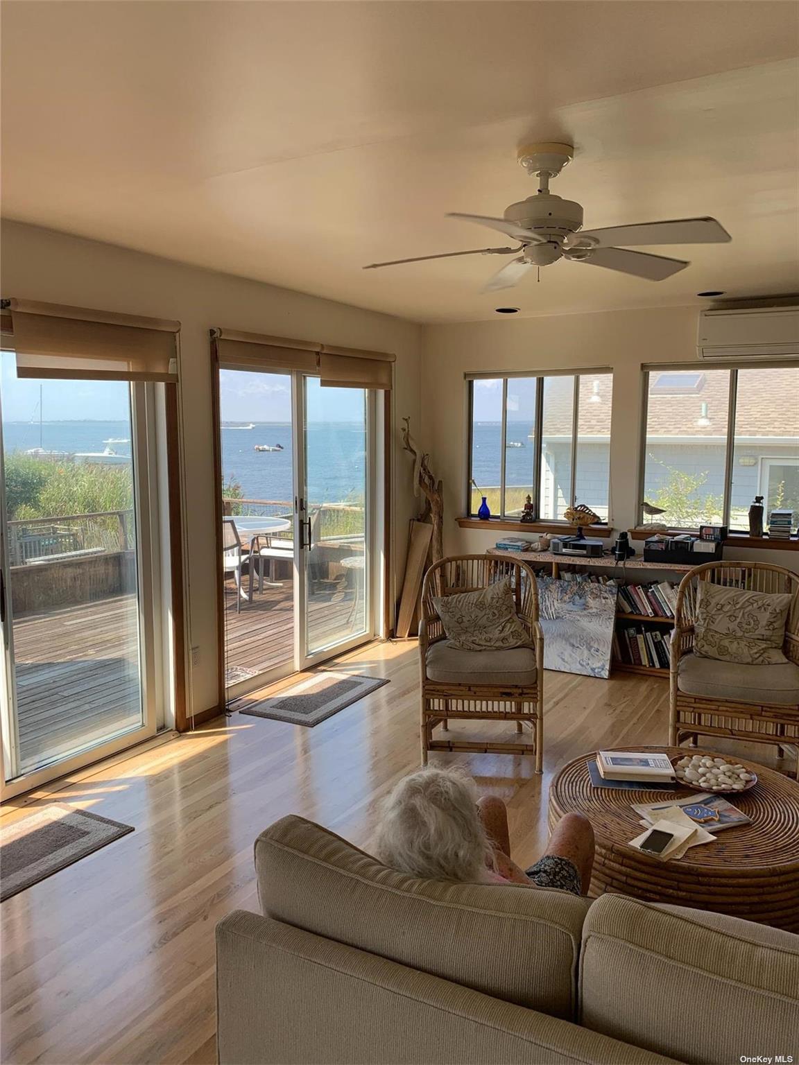 6 Sloop Walk Ocean Beach, NY 11770 - Photo 3 of 11 a living room with furniture and a floor to ceiling window