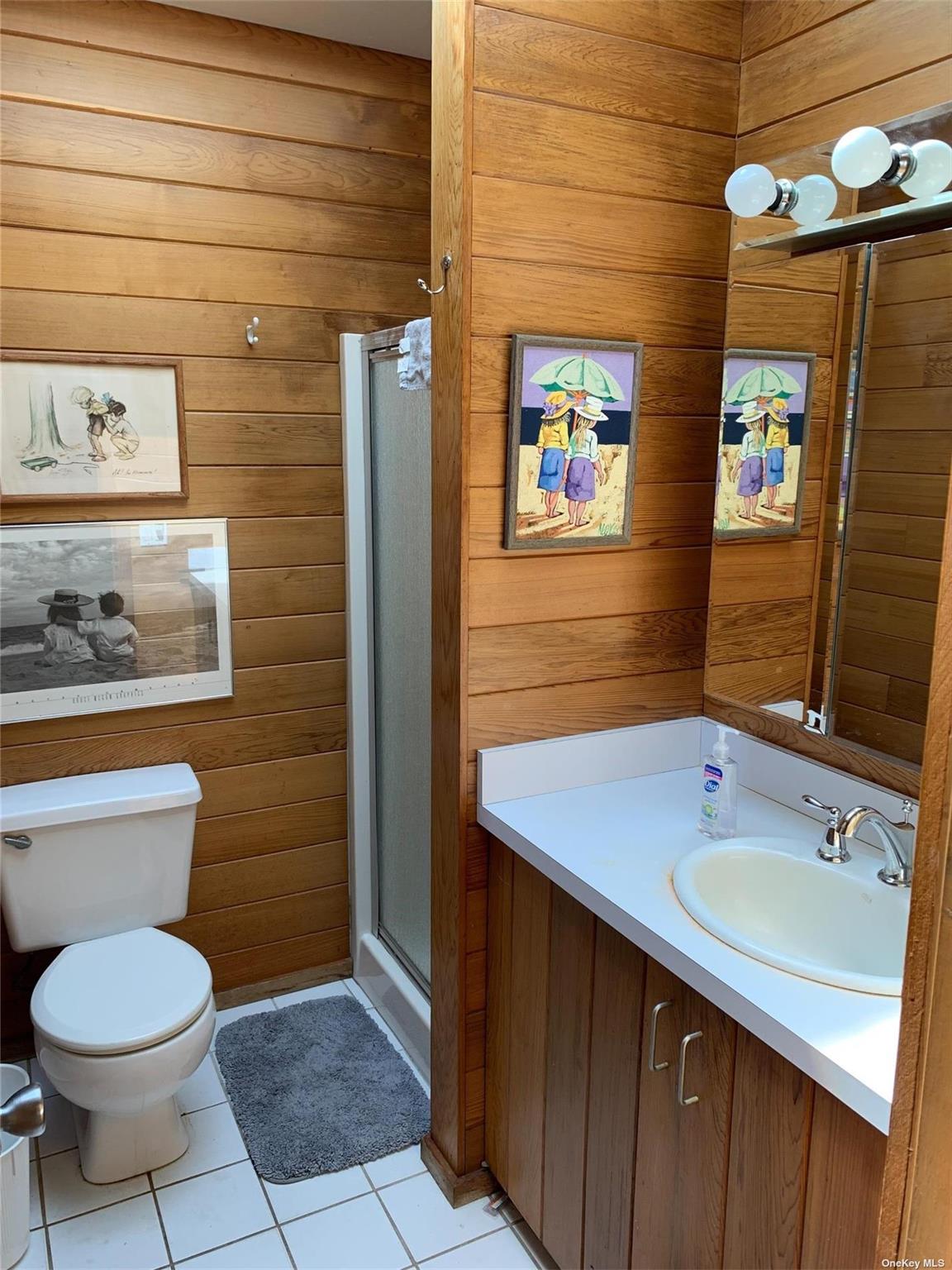 6 Sloop Walk Ocean Beach, NY 11770 - Photo 8 of 11 a bathroom with a sink a toilet and mirror
