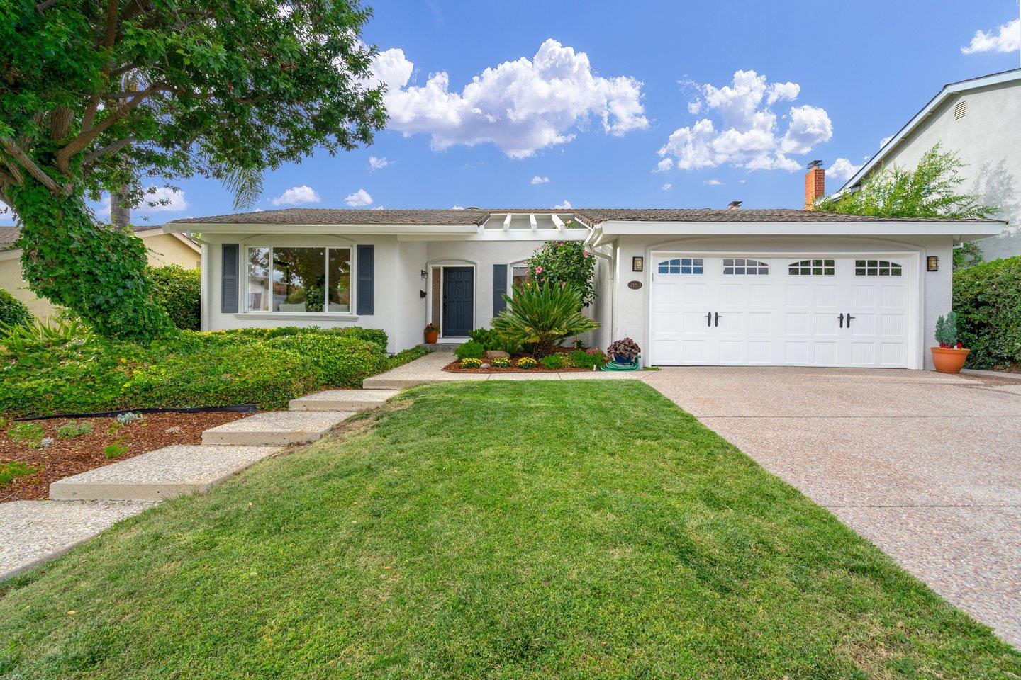 a front view of a house with garden